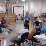 Dale E. Jaenke, assistant professor of automotive technology, briefs students on fuel-cell technology before turning them loose on hydrogen-powered model cars.