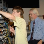 Jeff B. Weaver oversees a student's cable connection in the Center for Business & Workforce Development.