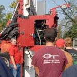 Jeff Roten shows students the vehicle's jumble of hydraulic hoses