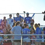 Fans make some noise with "Go Wildcats" thundersticks.