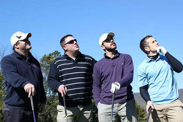 Hamming it up for the photographer is a foursome from Construction Specialties, including three alumni: David Bailey, ’00, technology management; Brent D. Hamm, ’98, plastics; and Anthony J. Peachey, '09, business administration. Team captain was Curtis M. Fessler (second from left).
