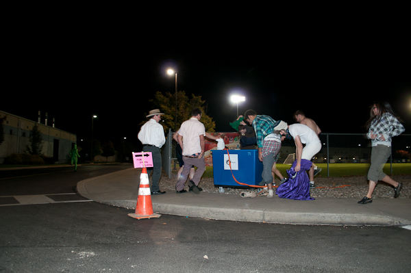 Participants in the Nearly Naked Mile shed their clothes for charity, dropping items into collection bins at several stops along the route.