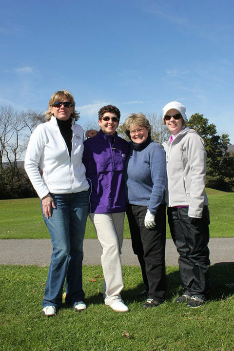 Terri L. Haluck, a 2000 graduate in occupational therapy assistant (left), assembled a team for the alumni golf tournament.
