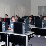 Attentive students focus on Linux instruction.