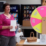 Kristi L. Hammaker, health and fitness specialist, asks a mental health-related question after a student takes a spin of the wheel.