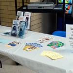 Pamphlets on topics from suicide prevention to eating disorders line an information table in the Hager Lifelong Education Center lobby.