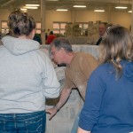 Instructor Robert Gresko offers personalized attention to students working with stone.