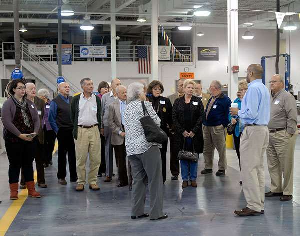 WTI alumni and their guests learn about the college's new automobile restoration technology major and more during a tour of the collision repair lab with Eric D. Pruden, automotive instructor, and Debra M. Miller, director of corporate relations.