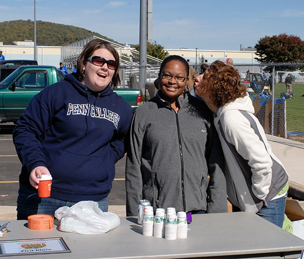 Having fun (and maybe huddling against the occasional chill, Student Activities co-workers staff the Chili Cook-Off judging table. From left are Sara R. Hillis, associate director; Malinda C. Love, assistant director for diversity and cultural life; and Kimberly R. Cassel, director.