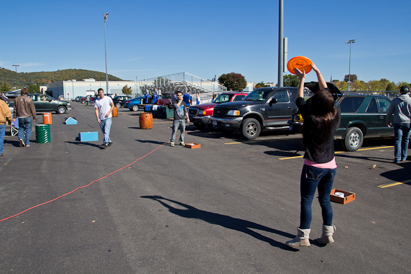 Frisbees, footballs and beanbags were flying during tailgate hours across the wide-open parking lot.