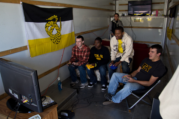 Sigma Nu brothers enjoyed all the comforts of home at the tailgate: video games and cozy furniture inside a rental truck, and a cookout just outside their door.