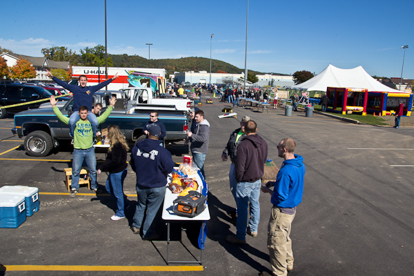 Enjoying a burst of fall sunshine and the company of friends, Construction and Design Technologies students join the tailgate fun.