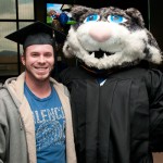 With the Wildcat's help, Eric M. Stahl, a civil engineering technology student from Muncy, tries out a graduation cap.