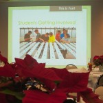 Poinsettias grace the tables as a slide show of the hydroculture process plays.
