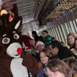 Passengers get a red-nosed reminder of the holidays at hand.