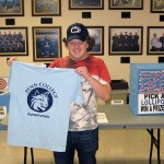 Andrew J. Wright, a web design and multimedia major from Mendham, N.J., shows off his Field House winnings.