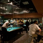 Students enjoy pool and other free activities in the CC Commons game room.