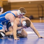 Tyler Myers, of Centre Hall, takes the upper hand on his way to a 5-2 decision at 157 pounds.