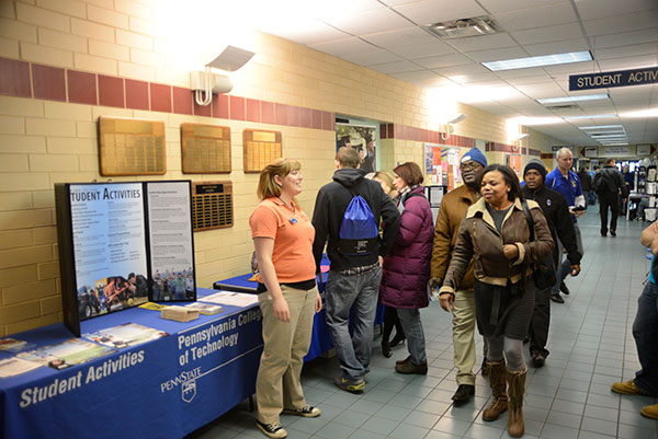 Student activities assistant Samantha E. Purcell staffs a booth in a Campus Center hallway.