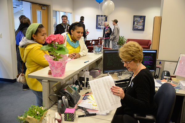 Leslie J. Baier, data control assistant in the Admissions Office, assists visitors to the Student and Administrative Services Center.