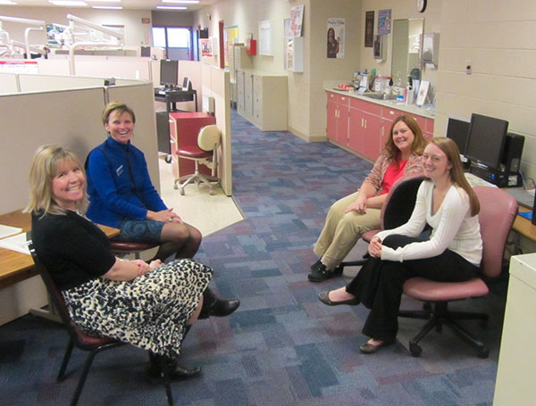 Welcoming visitors to the dental hygiene clinic are, clockwise from left, faculty members Kim A. Speicher and Mary Jo Saxe and students Tiffany A. Kilpatrick and Natalina R. D'Urso.