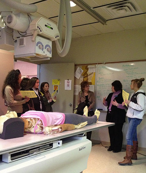 With compelling visual aids, clinical supervisor Nicole J. Tanner fields questions about radiography.