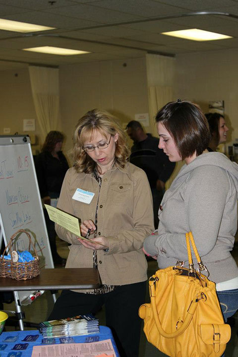 Nursing alumna Samantha M. Carey, Class of 2009, provides one-on-one attention for a prospective student.  