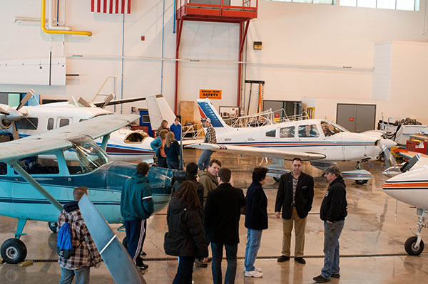 ... while his father, an associate professor of aviation, handled the crowd inside the Lumley Aviation Center hangar.