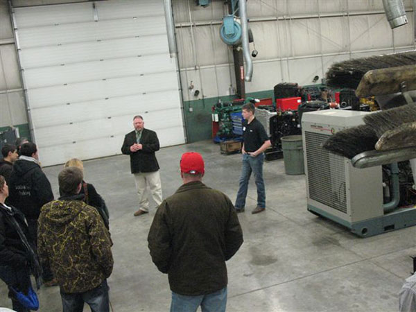Claude T. Witts, instructor of diesel equipment technology, and Lance D. Aucker, a diesel technology major from Millerstown, conduct lab tours at the ESC.