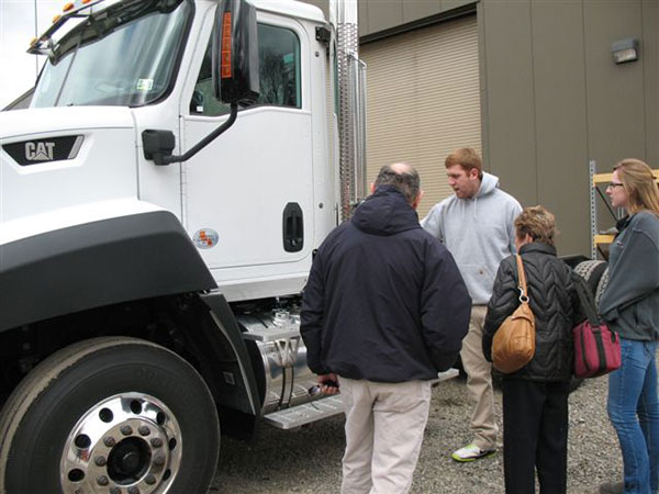 Diesel technology major Steven M. Seguine, president of the Diesel Performance Technicians Association, with a featured CAT diesel truck.