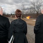 The group watches a simulated fire at the training site.