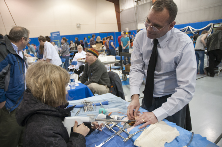 Scott A. Geist, director of Penn College’s Surgical Technology Program, shows a visitor how to use some of the tools of the operating room.