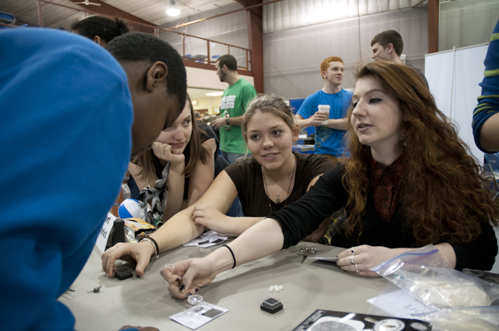Williamsport Area High School students show a visitor the details of his fingerprint.