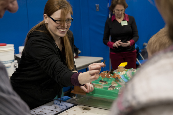 A member of the Muncy Creek Watershed Association shows a macroinvertebrate.