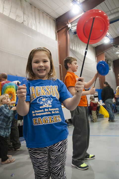 Exploring physics principals, a participant spins a plate.