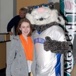 Morgan Bloom, a Montgomery eighth-grader and daughter of Noelle B. Bloom, an assistant Dining Services director, meets the Wildcat mascot prior to lunch in Dauphin Hall.