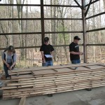 Visiting students hone their lumber-estimation skills near the ESC sawmill.
