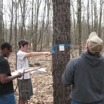 Forestry Field Day participants measure one of the countless trees within the ESC's spacious natural surroundings.