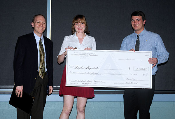 The Student Leader Legacy Scholarship, which has grown from $500 when first presented in 2007 to $1,750 this year, was awarded to Taylor R. Lapointe. Making the presentation are Robb C. Dietrich, executive director of the Penn College Foundation (left), and outgoing SGA President Ryan M. Enders.