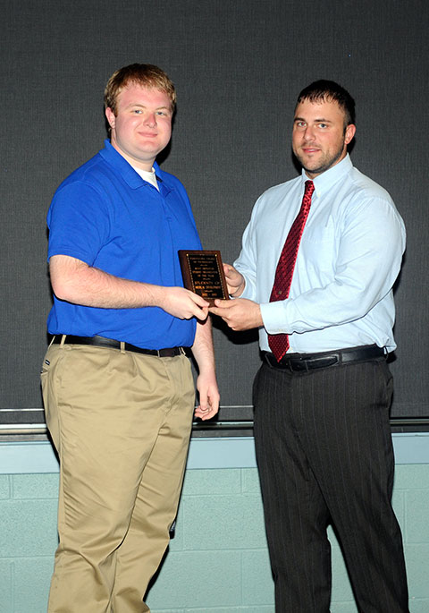 Jeremy L. Thorne (right), SGA’s vice president of finance, presents the Most Improved Student Organization award to Joshua W. Nadonley from Students of Musical Development. 