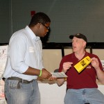 Paul Kinley, an Interlink missionary and Global Aid Network representative, seeks volunteer to pack 40,000 rice-and-beans meals in six hours at a local church on May 3-4.