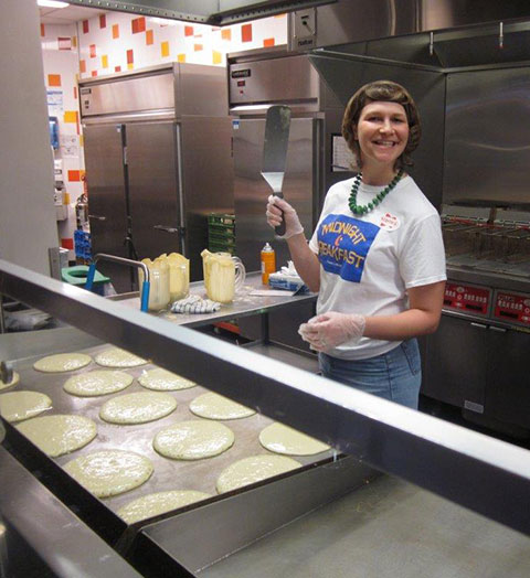 Wielding a mean spatula, Katie L. Mackey, coordinator of off-campus living and commuter services, waits for her flapjacks to reach golden-brown, bubbly perfection.