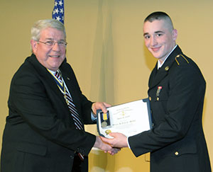 Cadet Daniel G. Curtin, of Berwick, receives the Tiadaghton Chapter of the Sons of the American Revolution Award from chapter President Thomas Gouldy.