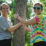 A "family tree?" Mother Nature provides convenient support for twins Kelcie L. (left) and Kaitlyn A. Murray, applied human services majors from Scranton.