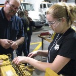Ken Bashista, laboratory assistant for diesel equipment technology, provides instruction on tearing down an engine.