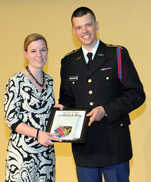 Carolyn R. Strickland, Penn College’s assistant vice president for academic services, is honorarily inducted into the National Society of Scabbard and Blade by Cadet Stephen M. Bessasparis, a Bucknell junior majoring in international relations. 