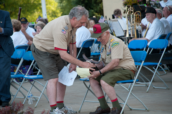 Anthony DiSalvo (seated) consults with master of ceremonies William Carlucci, president of the Susquehanna Council Boy Scouts of America.