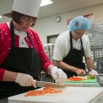 Susquehanna Health employees prep vegetables for their competition dishes.
