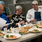 From left, Susquehanna Health President Steven Johnson, Penn College President Davie Jane Gilmour and Susquehanna Health Facility Director Greg Adams prepare to judge the dishes laid before them.