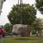 Under close observation, "The Rock" nears its resting place.